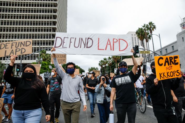 Protesters demand that cities 'defund the police.' Politicians are starting to listen.